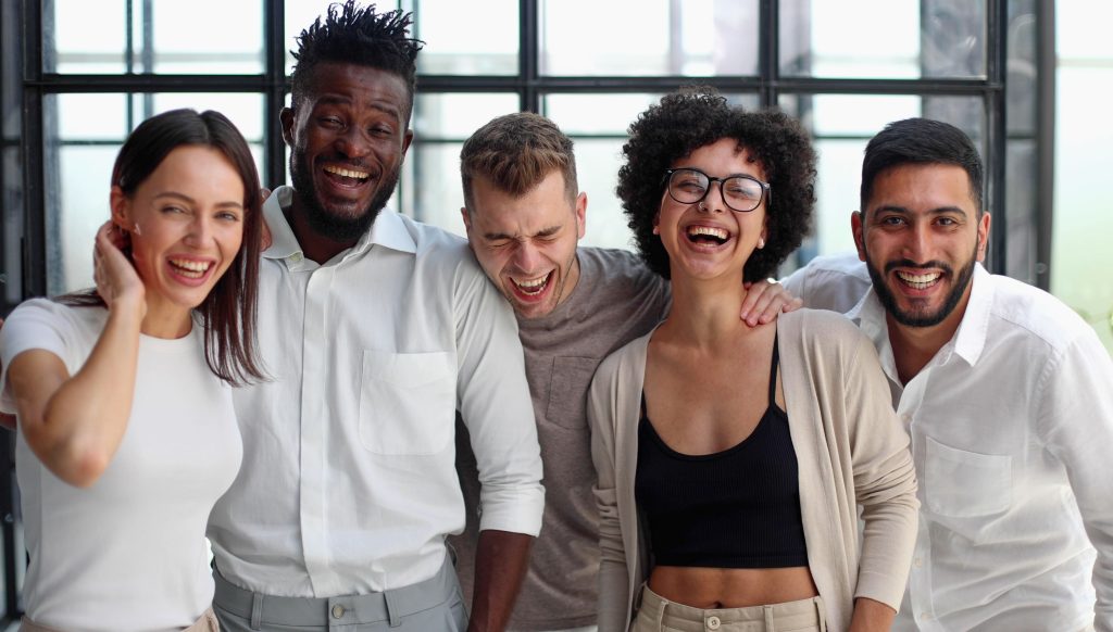 smiling-professional-business-leaders-employees-group-team-portrait (1)